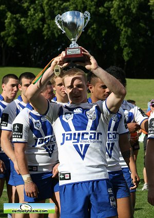 Brendan Cox holds up the National u16 Club Trophy (Photo's : OurFootyMedia)