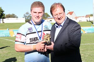Daniel Vasquez accepting his man-of-the-match trophy from Dave Trodden of the NSWRL following the SG Ball Grand Final victory over Souths. (Photo Steve Montgomery / OurFootyTeam.com)