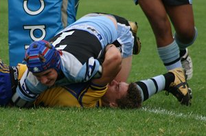 Harrison Day is held up by Parra's Jacob Gagan (Photo : ourfooty media)