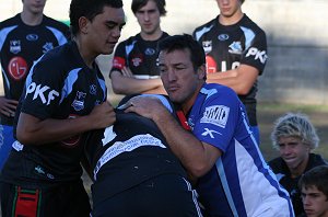 Sharks Junior Academy Co-Ordinator Alan Wilson shows the U15 the right way to tackle (Photo : OurFootyMedia)