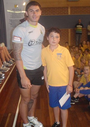 Daniel Vidot presents some awards at Bateman's Bay Primary School