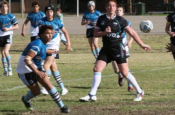 Micheal clears the ball for the Sharks 