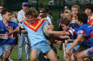 Reece Davidson struggles to fend off the agressive Dragons defence 