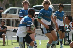 Alex Belford runs the footy 
