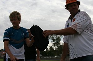 Col Wright give Daniel Small his gift for his teriffic game 