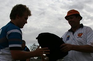 Col Wright gives De La forward Zac Wedersweiler his gift 