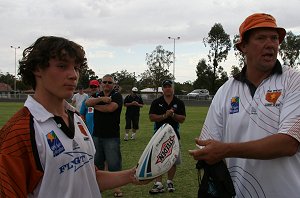Col wright prensents a footy signed by the Sharks NRL 1st Grade team 