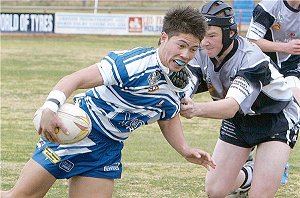 Charlie Mitchell just grabs a hold of Yenda player Chris Vaughan at Wade Park on Saturday.