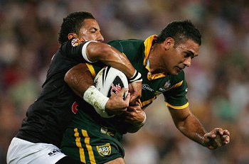 Big victory... Justin Hodges recieves attention from Benji Marshall during the Anzac Test (Getty Images)