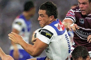 Arm wrestle ... Thanks to some Michael Monaghan magic, Manly scored a late four-point win over the Bulldogs last night. / The Sunday Telegraph