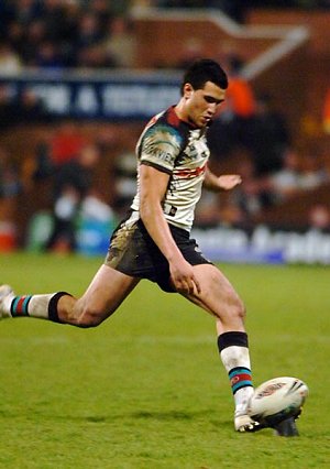Michael Mate kicks to get the game underway again