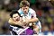 Sharks captain Brett Kimmorley tackles Storm player Billy Slater at Olympic Park