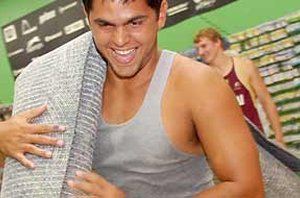 Anthony Coulton help with the mop up (Photo : Mackay Daily Mercury )
