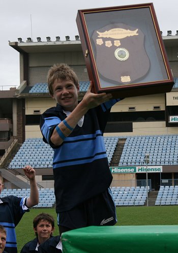 Muswellbrook PS Skipper Jake Parker hold up the Classic Shield (Photo's : Steve Montgomery / OurFootyTeam.com)