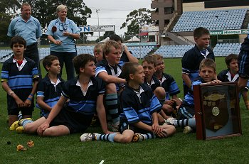Muswellbrook Primary School Boys wait for their turn to collect a Championship Pennant (Photo : ourfootymedia)