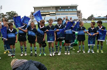 Muswellbrook Primary School Boys wave their Championship Pennants (Photo's : Steve Montgomery / OurFootyTeam.com)