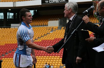 Gerald McCallum accepts the 'PETER STERLING MEDAL from Mr. Geoff Carr (Photo : ourfootymedia)