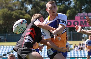 Man of the Match - Bryce Cartwright unloads in the gio Schoolboys Cup Grand Final (Photo : OurFootyMedia)