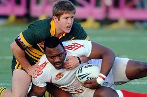 Casey Burgess layes on a great tackle on Mufaro Mvududu of the England Students team