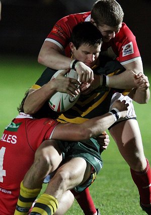 Nick O'Hara tackled by the Welsh defence (Photo : Ian Lovell/OurFootyMedia)
