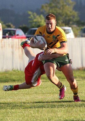 Beau Perry smashes thru the Kiwi line (Photo : Bill Phillips / DiGiSPORT / OurFootyMedia)