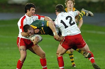 Marist College Student Mitchell Pearce tries a new way thru' the defence, or rought play ? U decide (Photo : RLPhotos.com - Dave Williams UK )