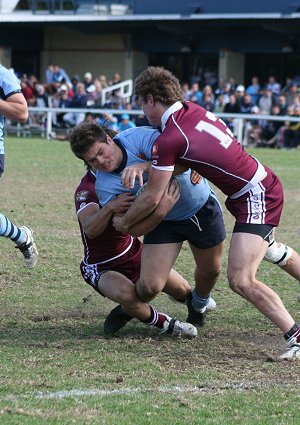 Queenslanders wrap up Paul Carter in the final of the Australian Schoolboys Championships (Photo : ourfootymedia) 