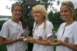 ‘SPECIAL WIN’: School chums (from left) Abbey Lloyd (captain), Caitlin Mills and Kate Mullaly with their Oztag trophies.
