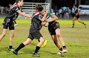 Daine Cox tests out the defence.