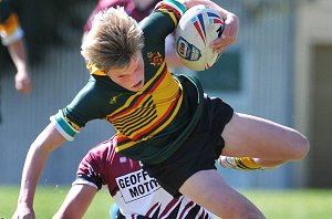 Josh Birmingham is just brought down by the Toormina defence after making a break late in the first half of their Buckley Shield clash yesterday
