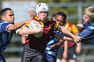 Ronin Hadden smashes thru tackle in Classic Shield