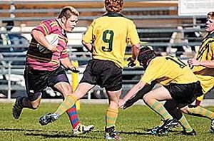 Daniel Johnson charges into the Farrer Gold defence of Tom Mellor and Kris Wall