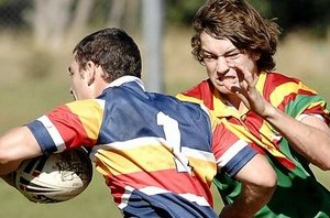 Mitchell Krause is hell-bent on stopping St Francis Xavier College�s Justin Smith in their Arrive Alive Cup rugby league game at Woodlawn yesterday. David Nielsen
