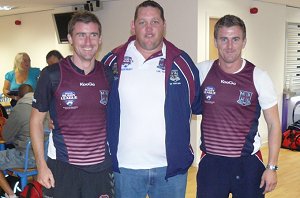 Nathan Doyle wakes up long enough to present a couple MACKAY Academy shirts 