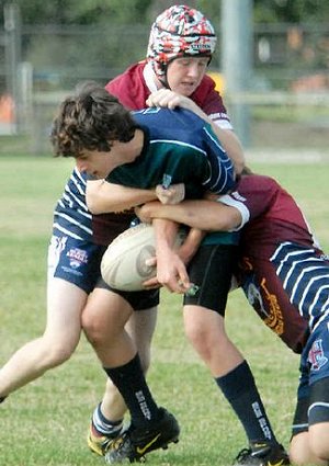 Mercy College’s Denzil Bowen meets strong defence from MSHS in the under-15 schoolboys’ final. Peter Holt