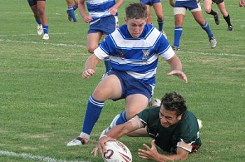Zac Wallwork chases down the Cav Rd player and the footy  (Photo : ourfooty media/Kirsty Fields Redcliffe SHS)